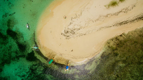 Aerial view of outriggers at beach