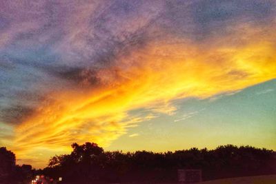 Low angle view of dramatic sky during sunset