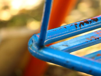 Close-up of chain swing ride in playground