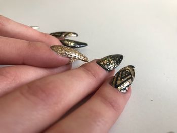Close-up of hand holding butterfly