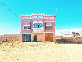 Built structure on desert against sky