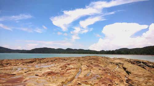 Scenic view of beach against sky