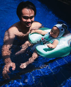 Young woman swimming in sea