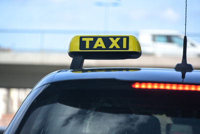 Close-up of car on road