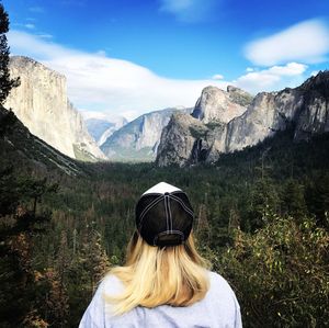 Rear view of woman against mountains