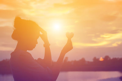 Portrait of silhouette man against sky during sunset