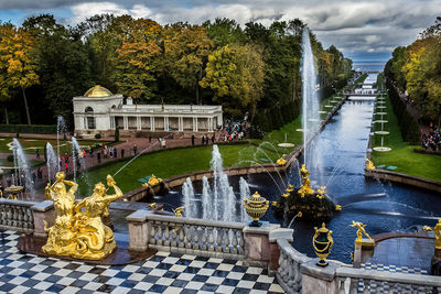 Fountain in park against sky