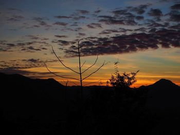 Scenic view of silhouette landscape against sky during sunset