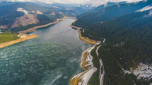 High angle view of river amidst mountains