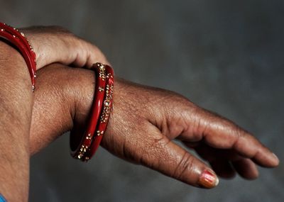 Close-up of woman hand with bangles 