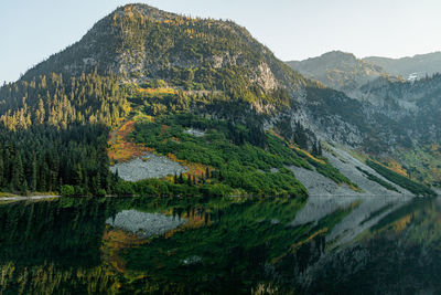 Rainy lake with beautiful reflection on pond in high alpine region of northern washington state