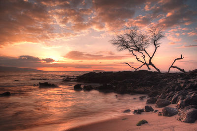 Scenic view of sea against sky at sunset