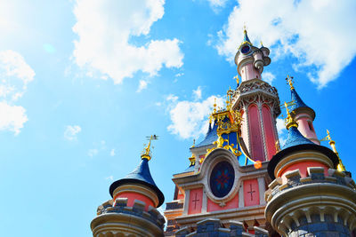 Low angle view of built structure against blue sky