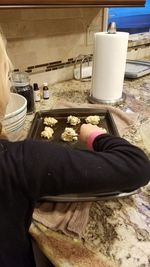 Low section of woman wearing shoes