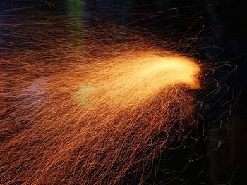 Low angle view of illuminated lights at night