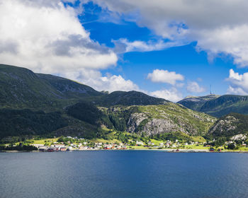 View of mountains and houses at sea coast