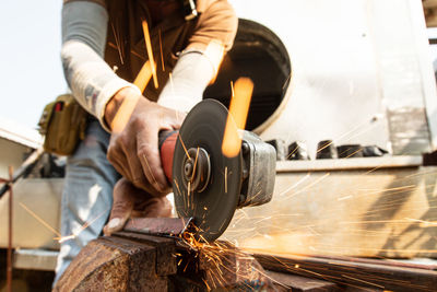 Low section of man working in workshop