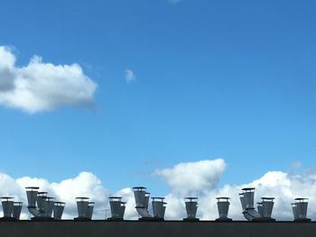 High section of built structures against blue sky