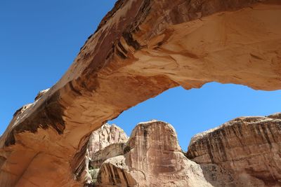 Low angle view of rock formations against sky