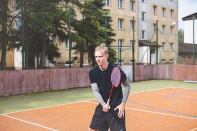 Portrait of young man playing tennis