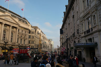 People walking on street in city