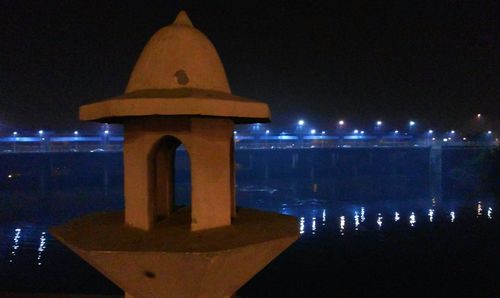 Reflection of church in water at night