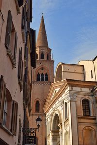 Low angle view of buildings against sky in city