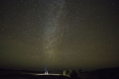 Scenic view of star field against sky at night