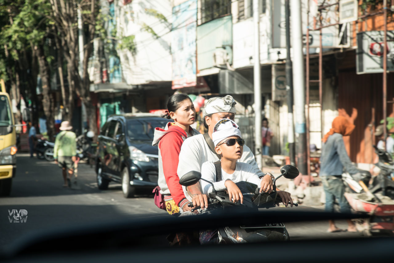 GROUP OF PEOPLE IN CITY