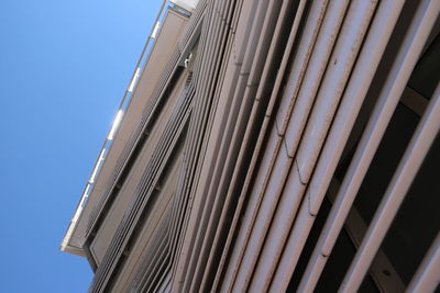 Low angle view of modern architectural  building against clear sky