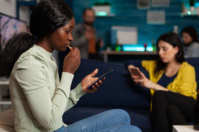 Young woman using mobile phone