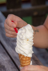 Hand holding ice cream cone