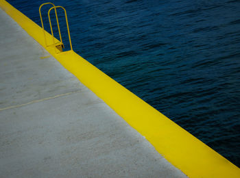 High angle view of yellow flag on beach