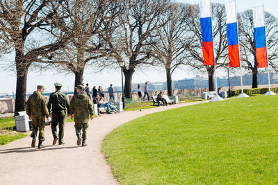 Man standing on footpath in park