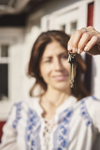 Woman holding house keys