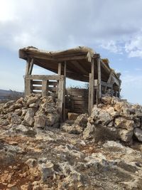 Low angle view of abandoned construction site against sky