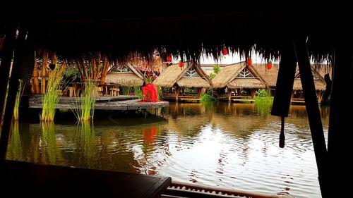 Reflection of built structure in lake at night