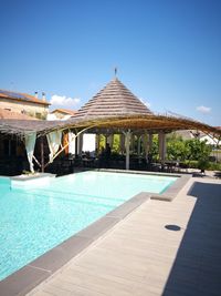 View of swimming pool against blue sky