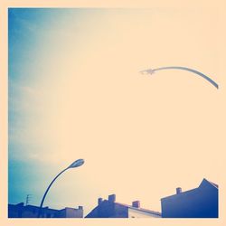 Low angle view of street light against sky