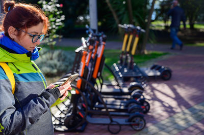 Full length of woman with bicycle