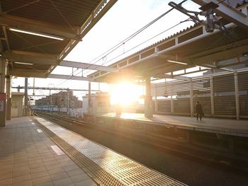 Train at railroad station against sky