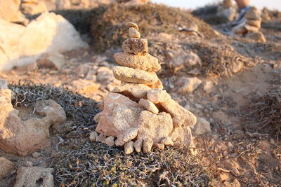 High angle view of stack of stones on field