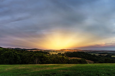 Scenic view of landscape against sky during sunset