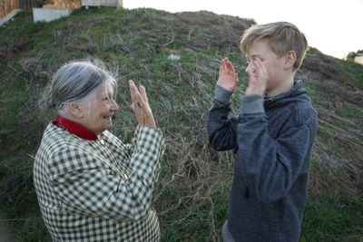 Boy playing with his grandmother