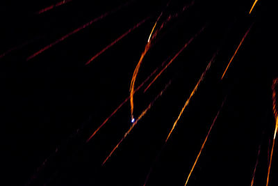 Low angle view of light trails at night