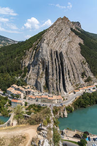 Panoramic view of buildings and mountain against sky