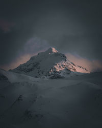 Scenic view of snowcapped mountain against sky