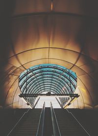 Low angle view of railroad tracks in tunnel