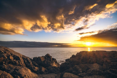 Scenic view of sea against sky during sunset