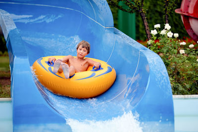 Smiling young man in swimming pool